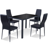 A sleek black dining table with four elegant chairs arranged around it, creating a modern dining space.